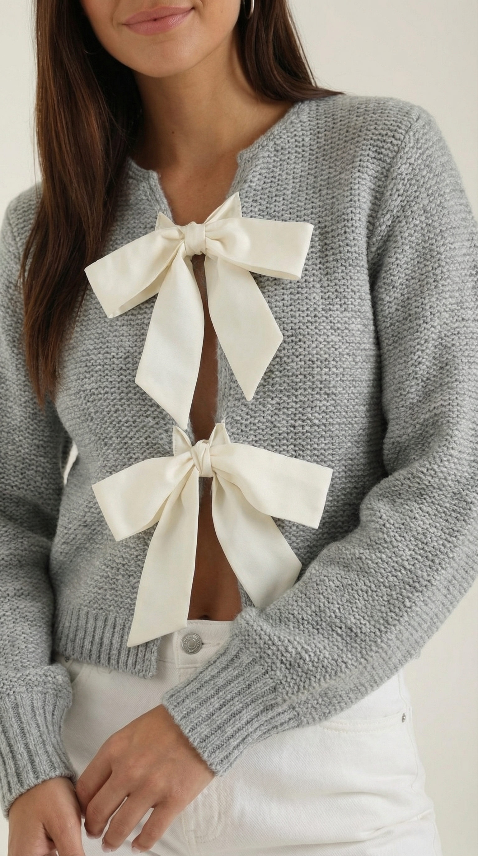 Top de punto con lazo decorativo