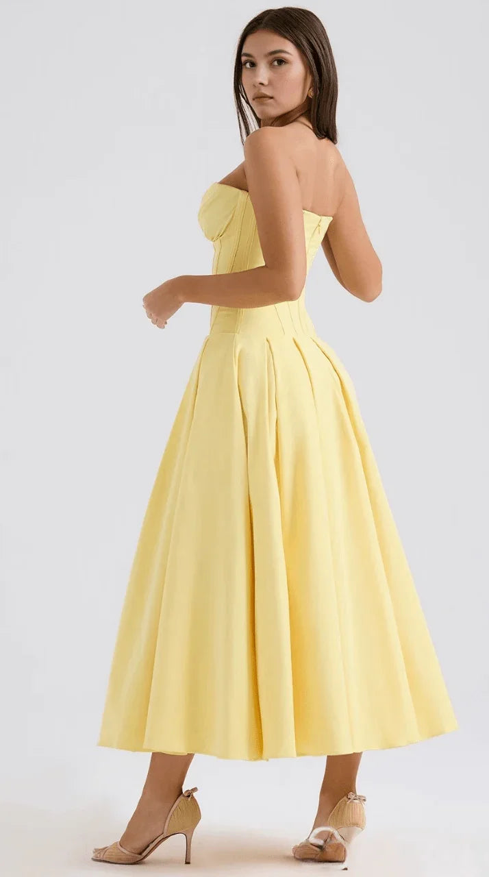 Vestido maxi fluido con detalles artesanales