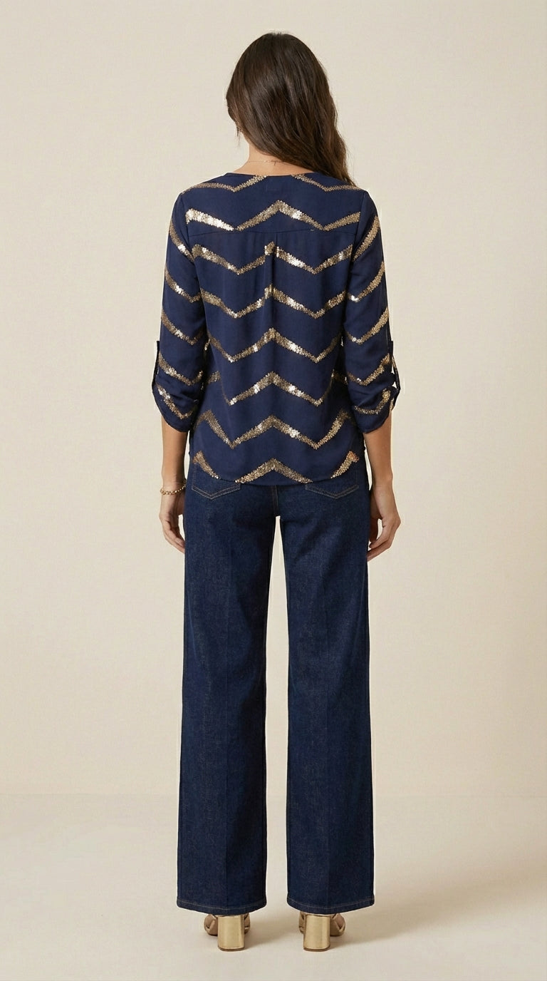 Blusa con cremallera semicerrada y acabado artesanal